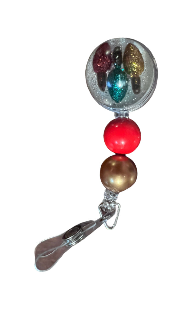 (G) Christmas lights with glitter dome. Permanent standard badge reel